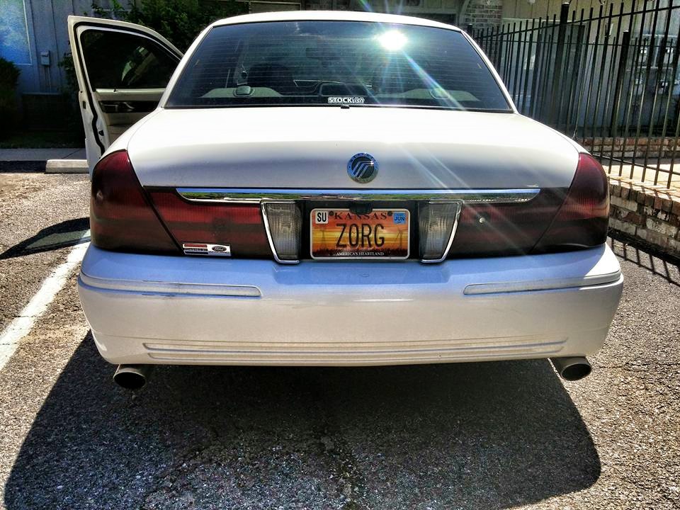 White 2000 Mercury Grand Marquis rear view with Kansas license plate ZORG