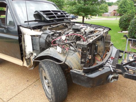 1983 Ford Bronco - All the damage is gone now, but I'm gonna pull that wheelwell and maybe the Y-pipe to fix the exhaust leak.