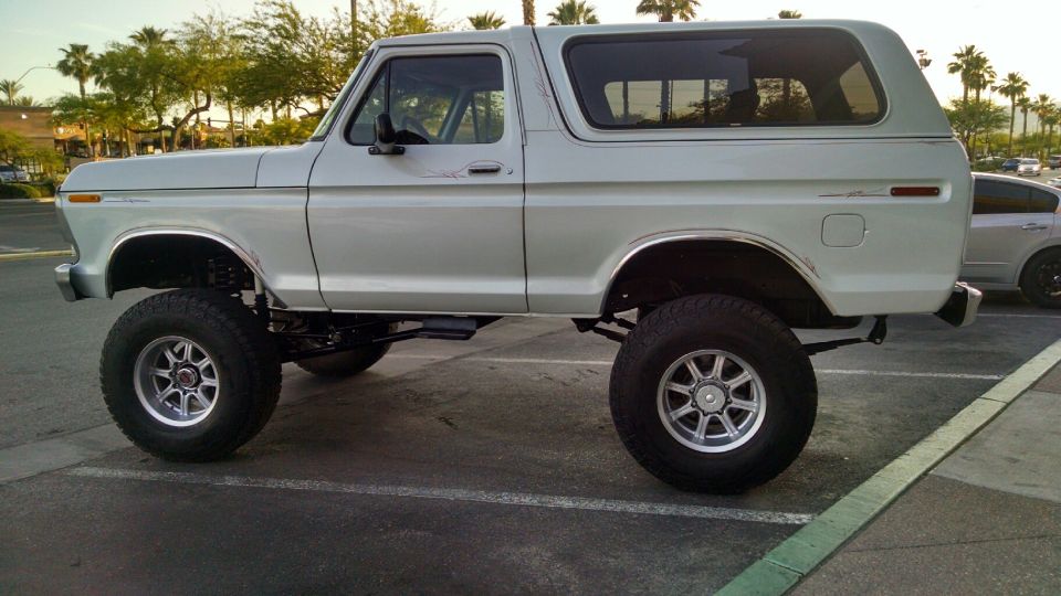 Lifted 1978 Ford Bronco parked in a lot