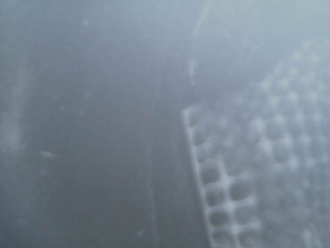 1994 Ford Bronco - A close-up view of an exhaust pipe, with the Supermotors.net logo visible in the lower right corner.
