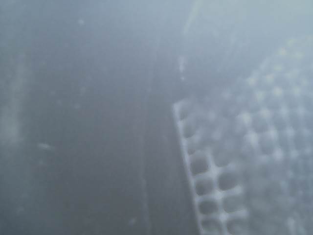 close-up of exhaust pipe with Supermotors.net logo