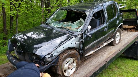 2003 Nissan Frontier - This 2003 Nissan Frontier sustained significant damage and is being transported on a flatbed trailer.