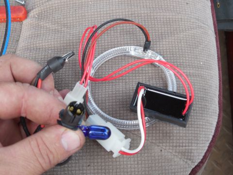 1983 Ford Bronco - The wedge connector spliced to 2 sets of wires supplies the halo & the large lens under the hi beam. The halo has 2 LEDs embedded in the bo…