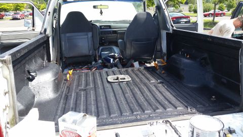 1993 Ford Bronco - Interior view of a white pickup truck bed with seats visible, showing signs of work.