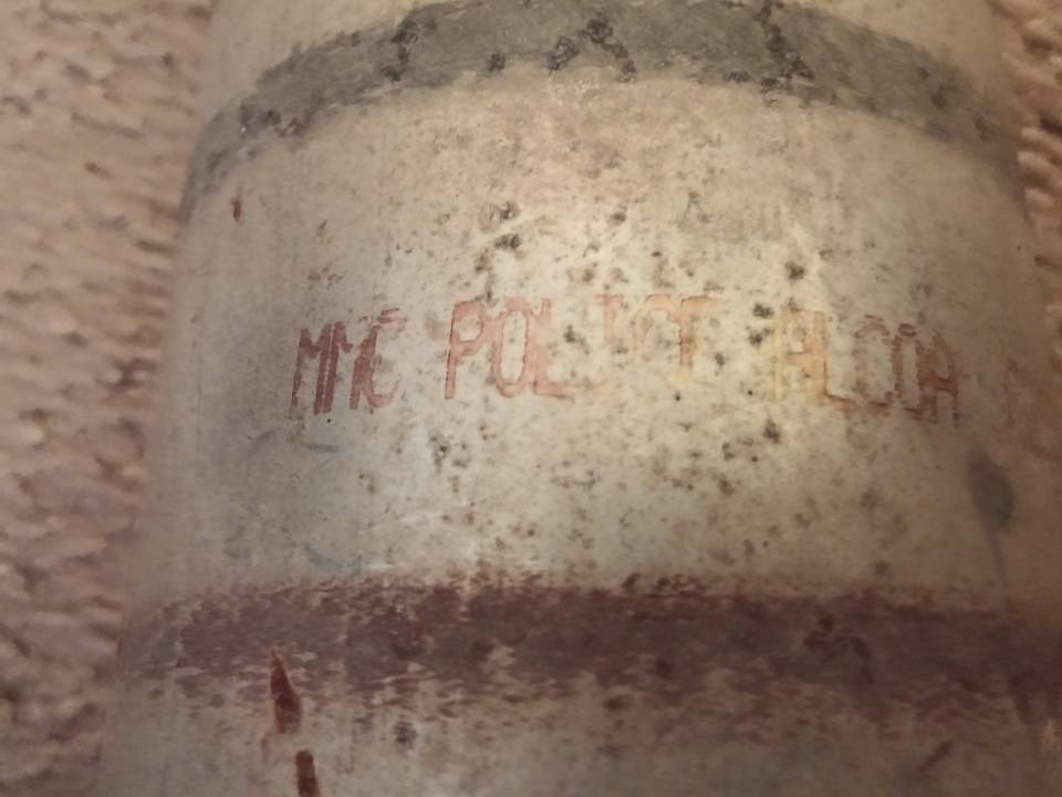 Part with red lettering 'MYC POLICE DEPT. ALCOA'