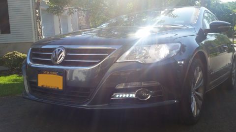 2010 Volkswagen Passat - Front view of a dark gray Volkswagen CC with a prominent grille and headlights.
