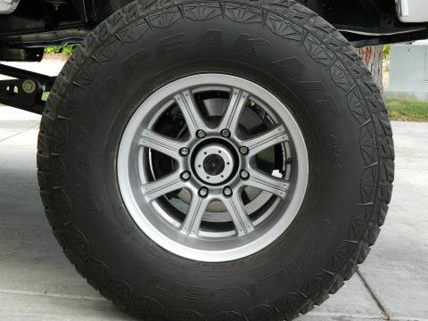 1979 Ford Bronco - Close-up of a wheel and tire assembly, likely from an off-road vehicle.