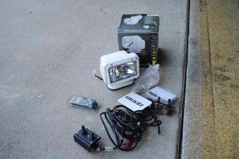 1986 Ford Bronco - GoLight remote spotlight kit includes spotlight, box, wiring, and two controllers.