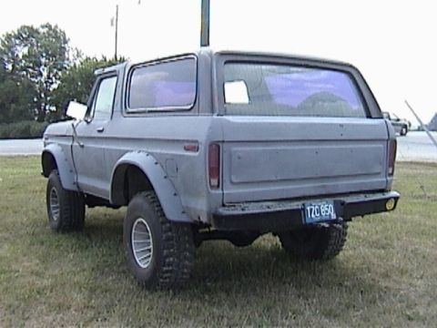 1995 Ford Bronco - This SUV features a rear view with aftermarket fender flares and a visible license plate.