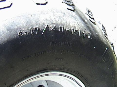 1995 Ford Bronco - Close-up of a tire sidewall with size and warning information visible.