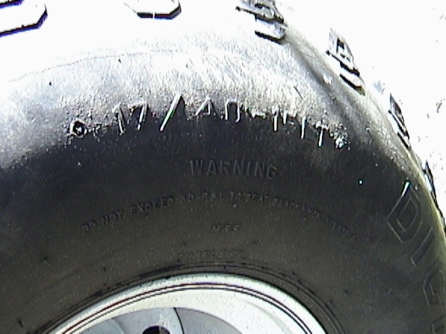 Tire sidewall showing size 31x10.50R17LT and WARNING text