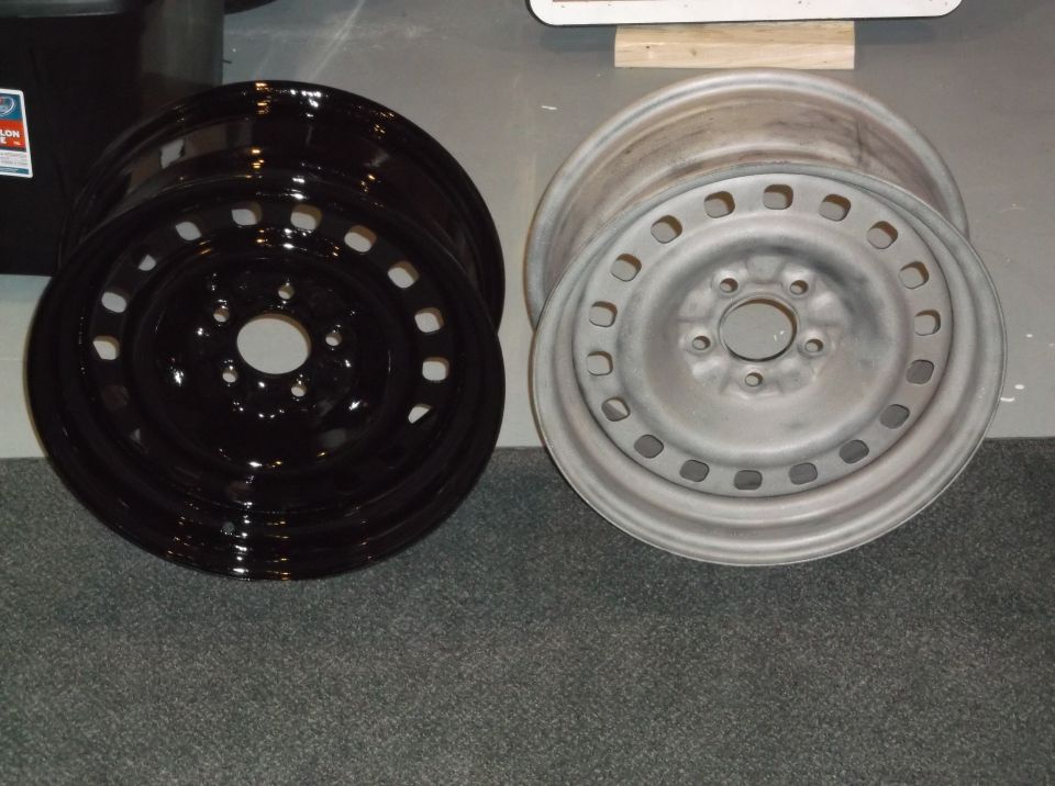 Two steel wheels, one black and one silver.