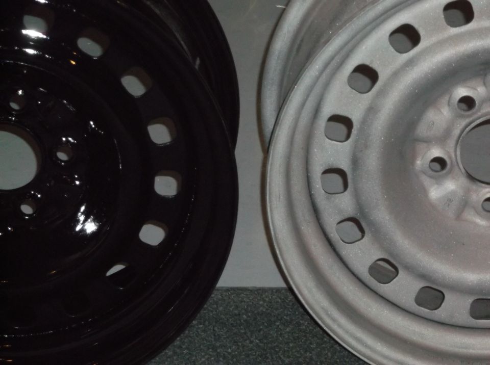 Two car wheels, one black and one silver, shown side-by-side.