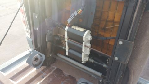 1995 Ford F-150 - Power seat mechanism components visible, likely from a truck interior.