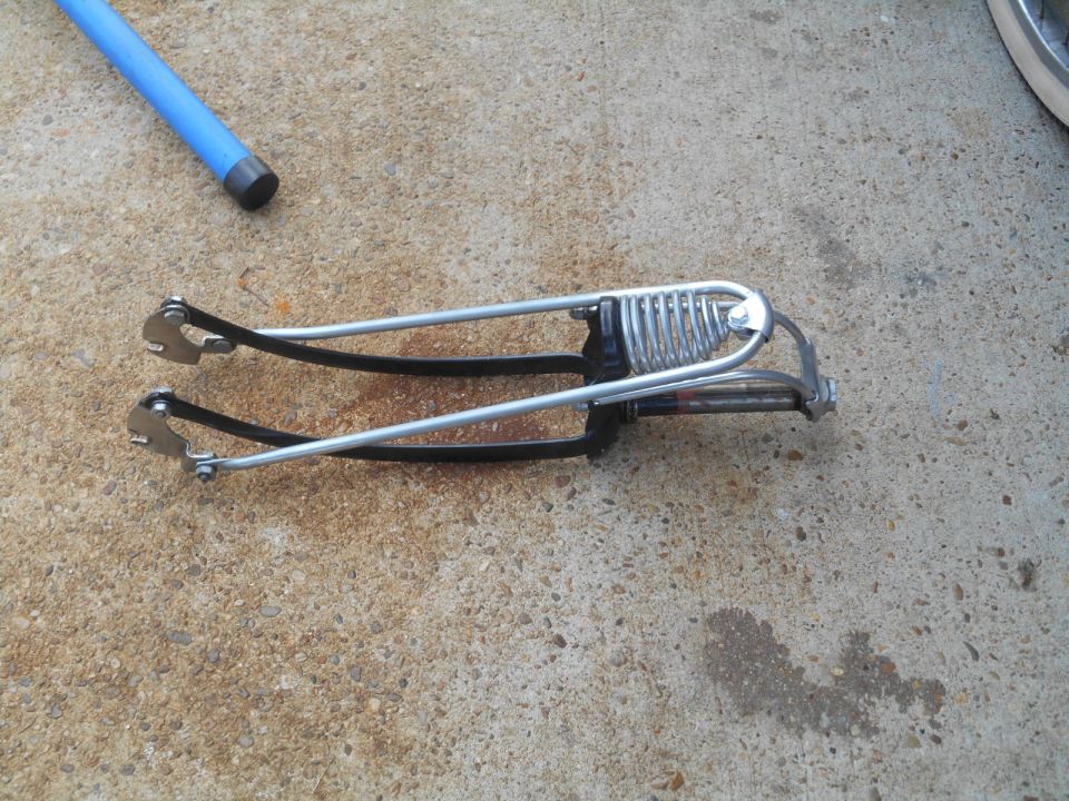 bicycle fork with springs and black straps