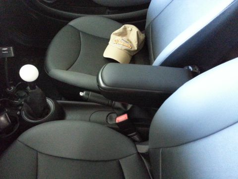 2003 Ford Crown Victoria - Interior view of a car showing seats, a shift knob, and a baseball cap.