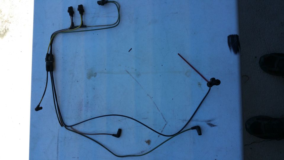 Wiring harness with multiple connectors and black boots
