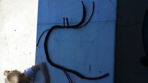 1990 Ford Bronco - Vacuum lines are shown laid out on a surface, possibly for repair or replacement.