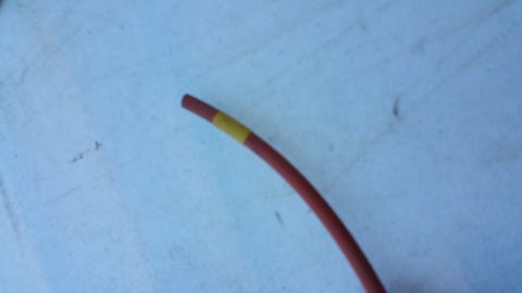 1990 Ford Bronco - A red vacuum line with a yellow band is shown, likely related to a repair or maintenance task.