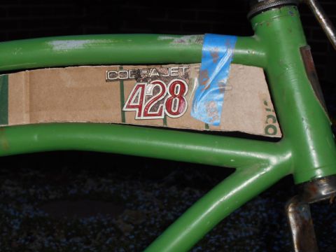 Green bicycle frame with Cobra Jet 428 decal and blue tape
