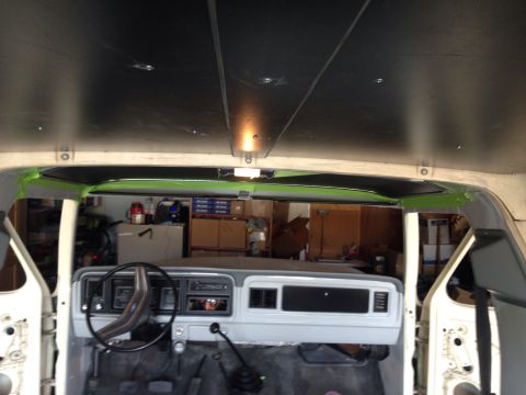 1978 Ford Bronco - Interior view of a classic Ford Bronco dashboard and headliner during a restoration. The dashboard is painted gray and the black headliner…