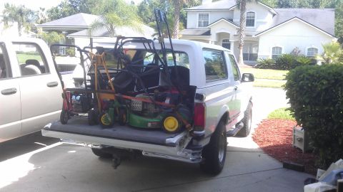 1994 Ford Bronco - I traded a 26 gallon Craftsman oilless air compressor for 3 mowers and 2 edgers, this is how they fit in the back of a Bronco.