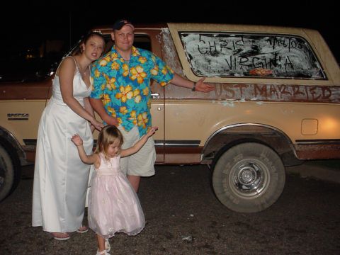 1987 Ford Bronco - Newlyweds and child pose with their decorated Ford Bronco on wedding day.