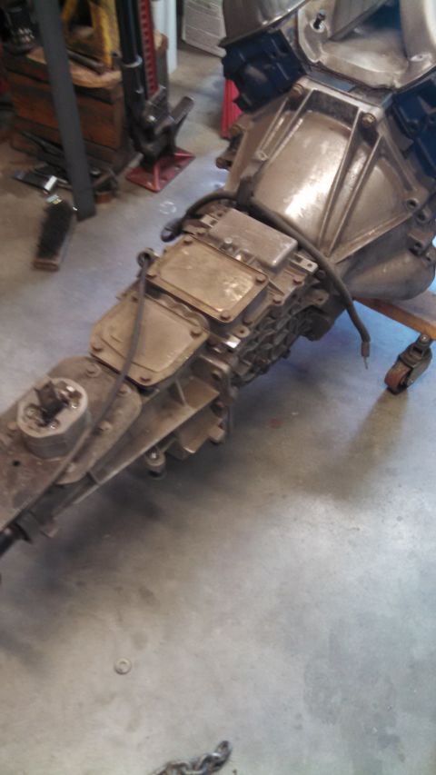 1988 Ford Bronco - This is a close-up view of a vehicle's engine and transmission assembly, likely removed for repair or replacement.