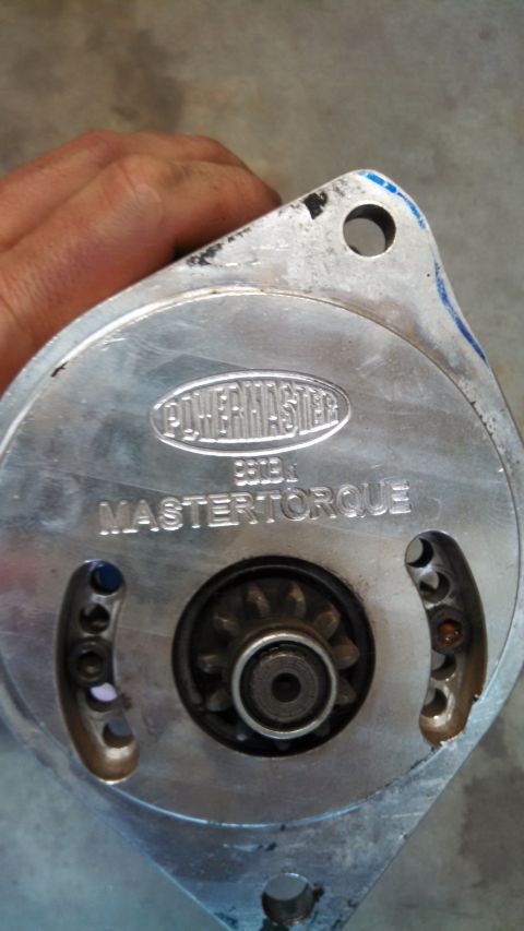 1988 Ford Bronco - Close-up of a Powermaster Mastertorque starter motor, showing the gear and mounting points.