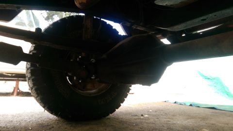 1976 Ford F-250 - The underside of a truck is visible, focusing on the rear axle, differential, and a tire. The registry claims it is a 1976 Ford F-250.