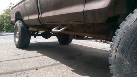 1976 Ford F-250 - Underside view of a 1976 Ford F-250 pickup truck, highlighting its chassis and exhaust system.
