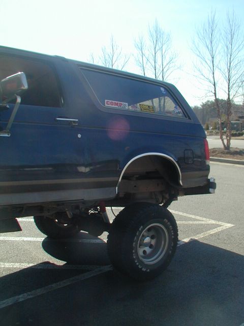 1988 Ford Bronco - This lifted Ford Bronco has large off-road tires and appears to be from the late 1980s.