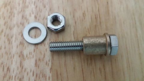1991 Buick Reatta - A bolt, nut, and washer assembly is shown on a wooden surface. A separate nut and washer are also visible.