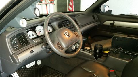 2003 Mercury Marauder - The interior of a 2003 Mercury Marauder features custom gauges and the distinctive Mercury emblem on the steering wheel.