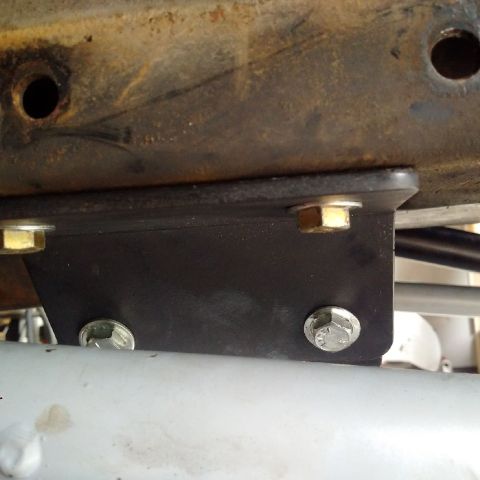 1978 Ford Bronco - Close-up of a vehicle's suspension bracket, showing bolted connections to the frame.