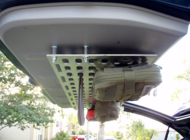 MOLLE panel mounted to vehicle tailgate with pouch and tool