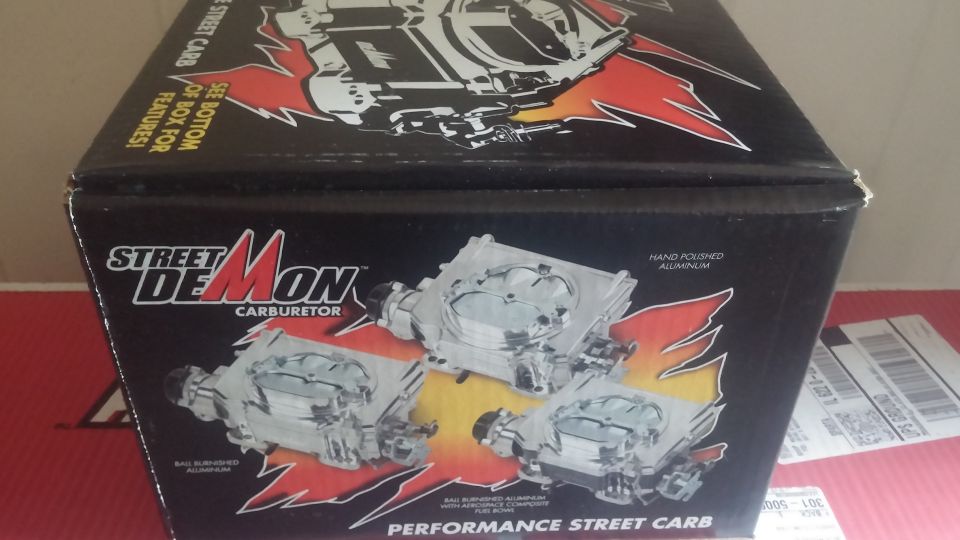 Box for a Street Demon carburetor with images of carburetors.