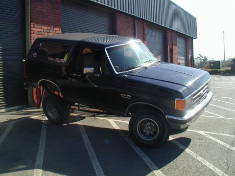 1988 Ford Bronco - This black Ford Bronco appears to be from the late 1980s, likely a 1987 model, based on its body style.