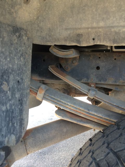 1997 Dodge 3500 - Close-up view of the rear leaf spring suspension system on a 1997 Dodge 3500.