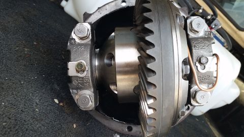 2003 Nissan Frontier - Close-up view of a vehicle differential, showing internal gears and housing with visible markings.
