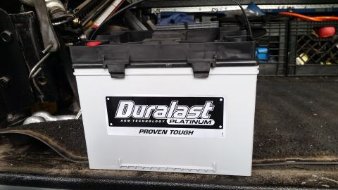2003 Nissan Frontier - A Duralast Platinum battery is shown, likely in the bed of a truck.