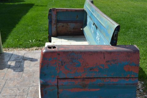1994 Ford Bronco - This bench is constructed from a vintage truck tailgate, showing significant wear and tear.
