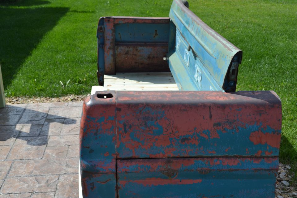 bench made from weathered blue and red truck tailgate