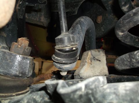 1999 Mercury Grand Marquis - Underside view of suspension components, including a sway bar end link and associated hardware.