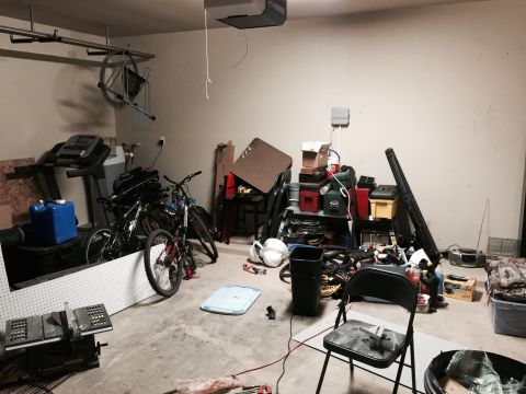 2015 Ford Deluxe - This garage scene contains various items including exercise equipment and bicycles, with no visible vehicle.