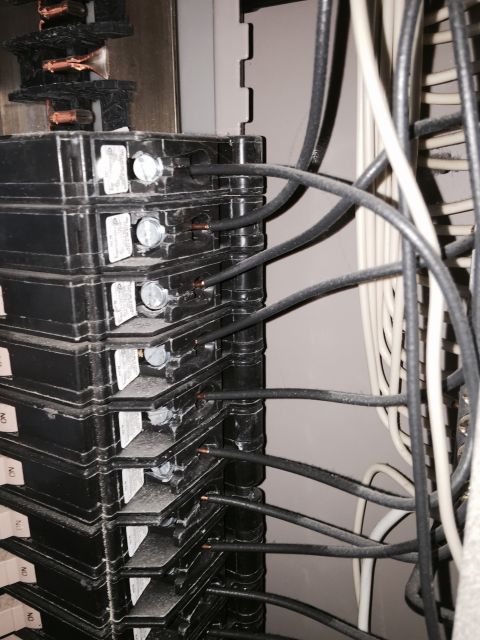 2015 Ford Deluxe - Close-up view of an electrical breaker panel with multiple circuits.