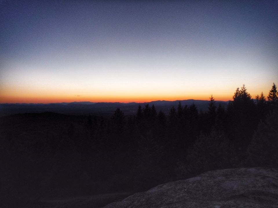 Sunset over mountains and forest