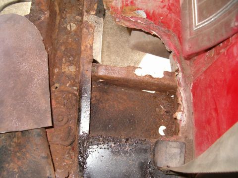 1979 Ford Bronco - Significant rust damage is visible on the vehicle's structural components.