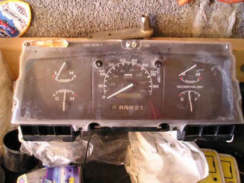 1994 Ford F-150 - Instrument cluster from a 1994 Ford F-150, showing gauges and gear selection.