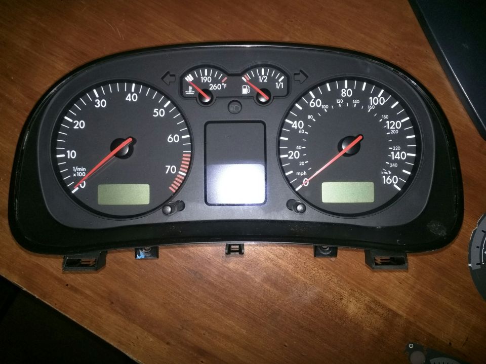 Volkswagen Jetta instrument cluster with tachometer, speedometer, fuel and temp gauges.